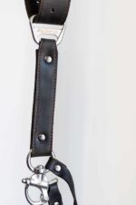 Close-up of a dark brown leather camera strap connector with metal ring and swivel clasp on a white background.