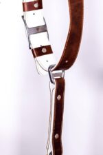 Detail view of Brown Vintage White Padding harness center strap showing white padded surface, brown leather accent bands, metal square connectors, and riveted construction