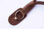 Brown leather strap end with metal split ring and stitched leather tab.
