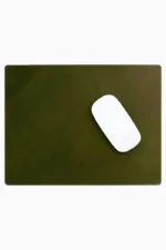 Olive green leather mouse pad with tone-on-tone perimeter stitching and rounded corners, with a white wireless mouse placed on the right side, top-down view on a white background.