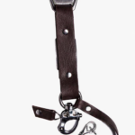 Close-up of dark brown leather camera strap end with silver clasp and rivet details on a light background.