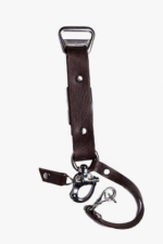 Close-up of dark brown leather camera strap end with silver clasp and rivet details on a light background.