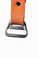 Rectangular metal ring for camera harness slider, close-up on white background
