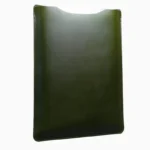 Green leather MacBook sleeve with stitched edges, displayed at angle showing protective padded interior and minimalist design