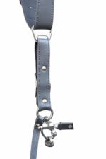 Vertical detail of Grey Sandstone harness showing stacked leather segments with metal square connectors, rivets, and metal carabiner clip at base