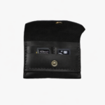 Black leather battery and SD card holder opened to show storage slots with memory cards inside on a light gray background.