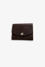 Dark brown leather battery and SD card holder pouch with snap button closure and stitched edges on a light gray background.