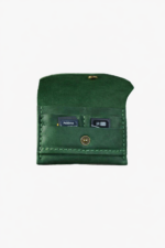 Green leather battery and SD card holder opened to show storage slots with memory cards inside on a light gray background.