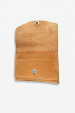 Open light brown leather battery and SD card holder with multiple card slots, snap closure, and suede interior on a light gray background.