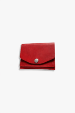 Red leather battery and SD card holder pouch with snap button closure and stitched edges on a light gray background.