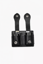 Black leather dual battery holder with two hanging tabs on a light background.
