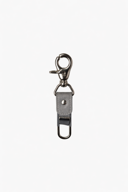 Gray leather key clip with swivel clasp and loop attachment on a light background.