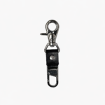 Black leather key clip with swivel clasp and loop attachment on a light background.