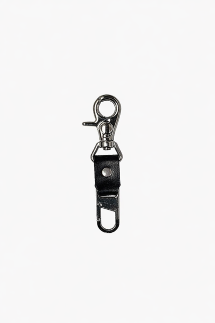 Black leather key clip with swivel clasp and loop attachment on a light background.