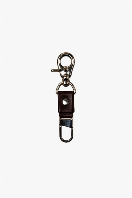 Dark brown leather key clip with swivel clasp and loop attachment on a light background.