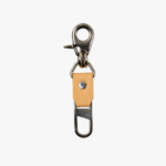 Light brown leather key clip with swivel clasp and loop attachment on a light background.