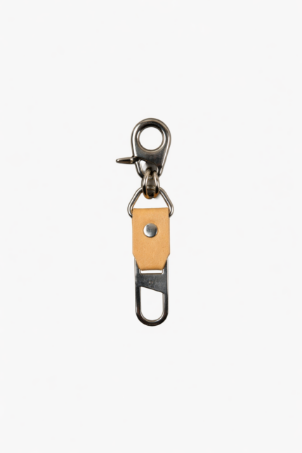 Light brown leather key clip with swivel clasp and loop attachment on a light background.