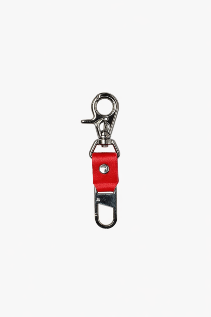 Red leather key clip with swivel clasp and loop attachment on a light background