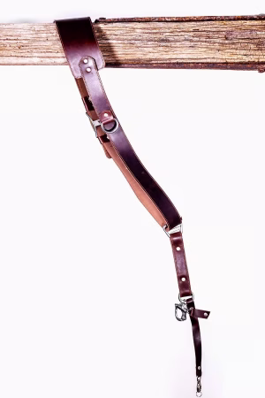 Angled view of the Garioch single camera strap in dark brown leather showing length and hardware connection.