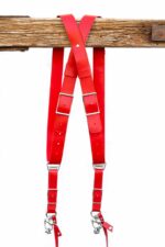 Red Campari leather camera harness lay-flat view showing complete X-design with dual shoulder strap paths, adjustable leather patch segments, and metal carabiner clips at base attachment points