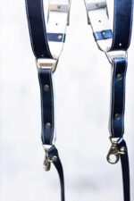 Two Royal Blue Metallic leather camera straps displayed parallel, showing metal slide connectors with engraved logo and white stitch detailing