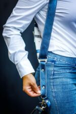 Detail shot of single Royal Blue Metallic leather strap showing metal ring connector, white contrasting stitching, and metallic leather surface texture