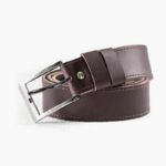 Dark brown leather belt with silver buckle on white background