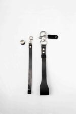 Two black leather strap lengths with metal swivel clasp and hardware, laid flat on a white background.