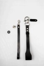 “Black leather camera wrist strap with swivel clasp, shown with mounting screw and washer on a white background.