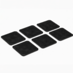 Set of six black leather coasters with stitched edges arranged on a light gray background.
