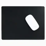 Black leather mouse pad with tone-on-tone perimeter stitching and rounded corners, with a white wireless mouse placed on the right side, top-down view on a white background.