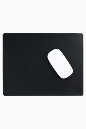 Black leather mouse pad with tone-on-tone perimeter stitching and rounded corners, with a white wireless mouse placed on the right side, top-down view on a white background.