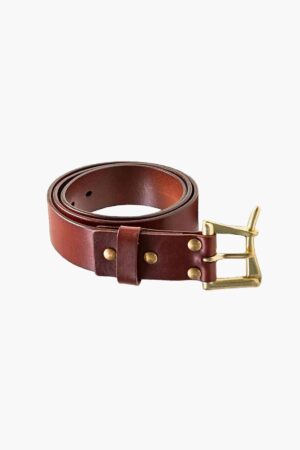 Brown leather belt rolled with brass buckle on white background