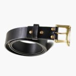 Black leather belt rolled with brass buckle and rivet details (second angle)