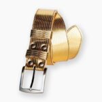 Gold padded leather trouser belt rolled up with silver buckle and matching gold bow tie on dark background
