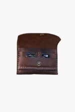 Open leather battery holder for camera with SD card slots visible, front view.”