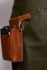 Backstrap leather apron deluxe on model – back view showing cross-back strap design