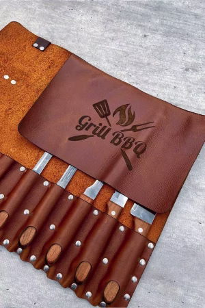 Close-up of leather knife holder 7s slots and buckle detail