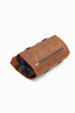 leather shaving bag open showing multiple compartments