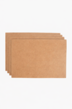 Stack of light brown leather card sleeves on a light background.