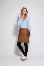 Long waist leather apron worn by woman – side view showing back pocket