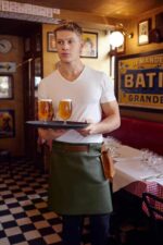 Long waist leather apron worn by woman – full look with leather belt