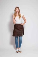 Short suede leather apron with back pocket – worn by woman, side view