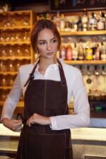 Suede leather apron worn by man – back view showing hip tie straps
