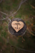 Wood Ring Box closed showing smooth pine wood surface and engraved Genuine Strap logo