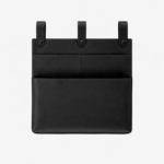 Black leather wall pocket organizer with three hanging tabs on a light background.