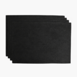 Stack of black leather card sleeves on a light background.