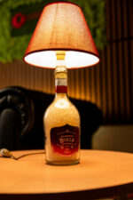 Handcrafted Bolle bottle lamp – lit up warm glow