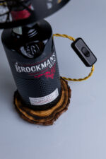 Handcrafted Brockmans bottle lamp – close-up of dark bottle