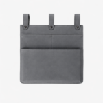 Gray leather wall pocket organizer with three hanging tabs on a light background.